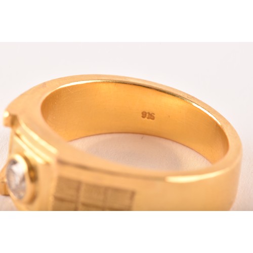 82 - A high carat gold gents dress ring, bezel-set with a round brilliant-cut diamond of approximately 0.... 