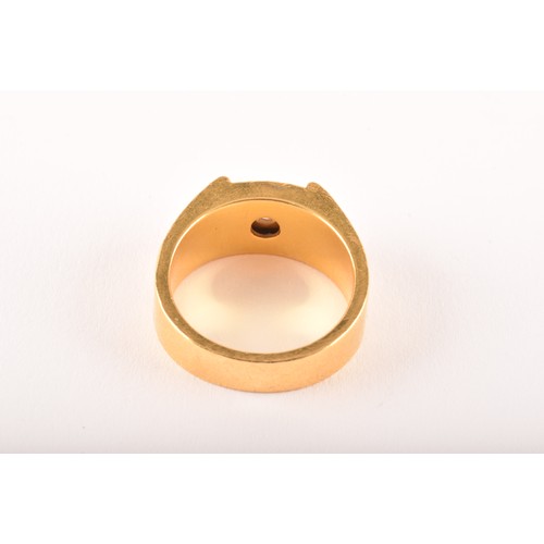 82 - A high carat gold gents dress ring, bezel-set with a round brilliant-cut diamond of approximately 0.... 