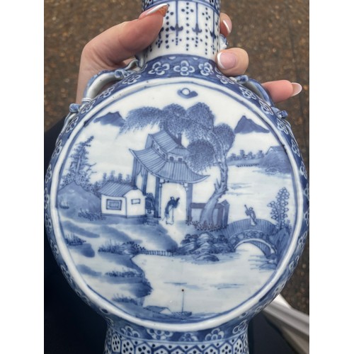 5 - A Chinese blue and white moon flask, with twin dragon handles, the body painted with a scene of figu... 