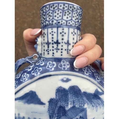 5 - A Chinese blue and white moon flask, with twin dragon handles, the body painted with a scene of figu... 