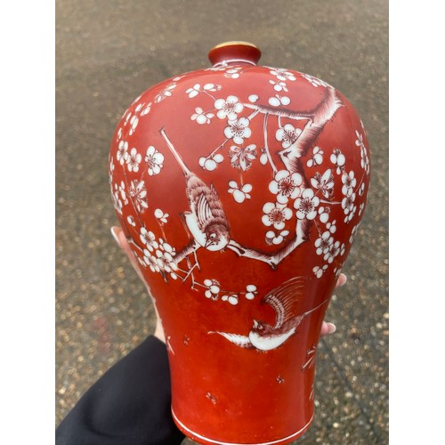 14 - A Chinese porcelain red ground blossom vase, with narrow turquoise glazed neck, the body painted wit... 