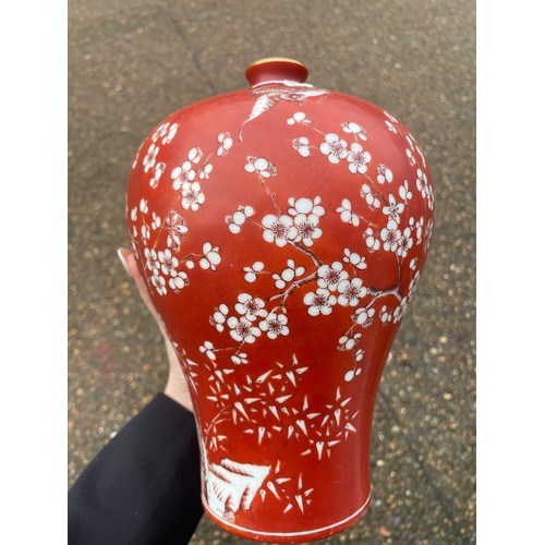 14 - A Chinese porcelain red ground blossom vase, with narrow turquoise glazed neck, the body painted wit... 