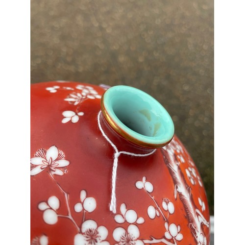 14 - A Chinese porcelain red ground blossom vase, with narrow turquoise glazed neck, the body painted wit... 