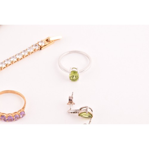 69 - A silver gilt and peridot line bracelet, together with a CZ line bracelet (lacking one stone), a sil... 