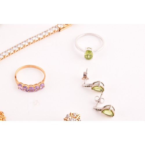 69 - A silver gilt and peridot line bracelet, together with a CZ line bracelet (lacking one stone), a sil... 