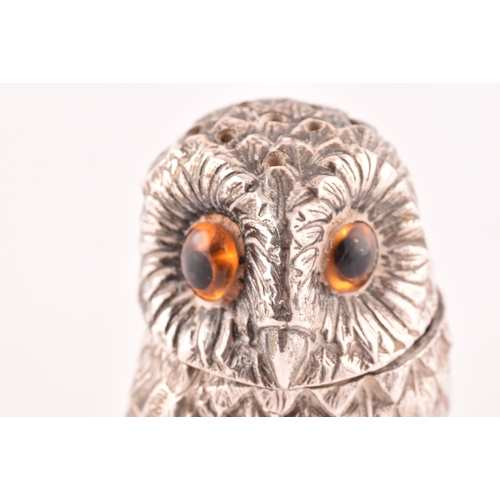 110 - A silver owl pepperette and a silver bird bird holder, owl has orange stone eyes and a detachable he... 