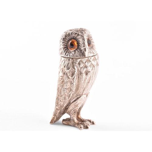 110 - A silver owl pepperette and a silver bird bird holder, owl has orange stone eyes and a detachable he... 