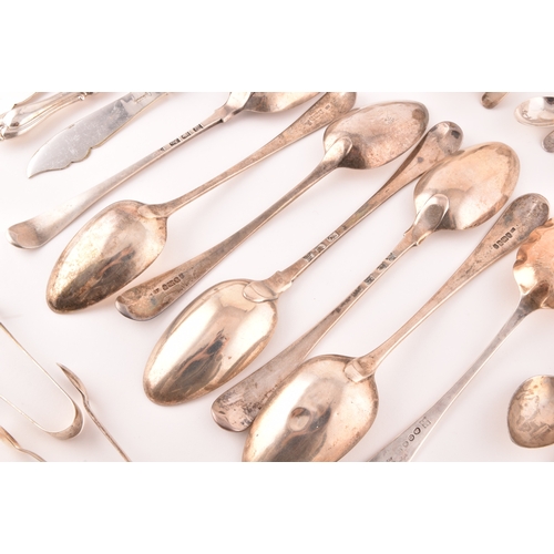 111 - A collection of Georgian and Victorian silver cutlery, to include an array of spoons, knives, a tea ... 