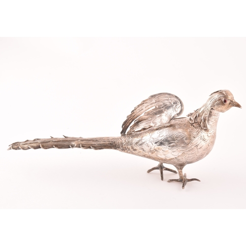 113 - An ornamental silver pheasant, import mark for Chester 1903 by Samuel Boyce Landeck, articulated win... 