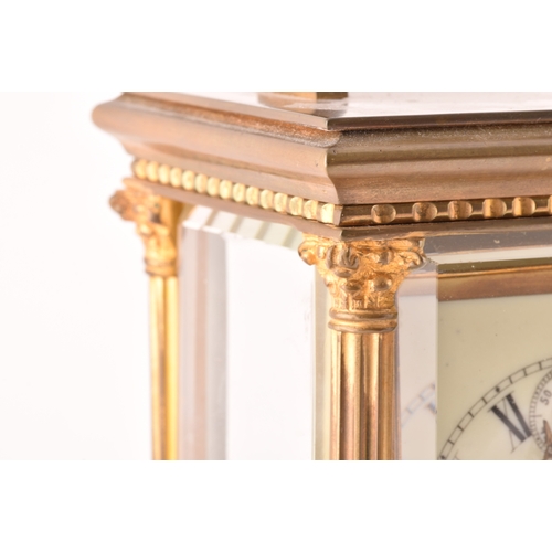 273 - A late 19th/early 20th century ormolu carriage clock, white enamel dial with subsidiary seconds dial... 