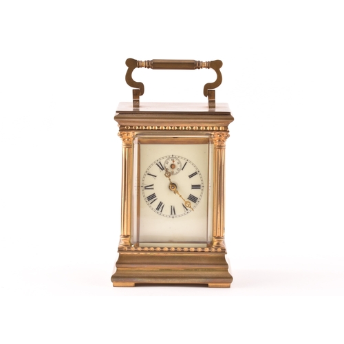 273 - A late 19th/early 20th century ormolu carriage clock, white enamel dial with subsidiary seconds dial... 