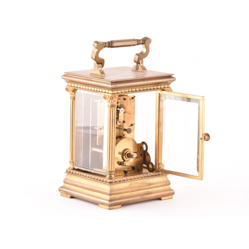 273 - A late 19th/early 20th century ormolu carriage clock, white enamel dial with subsidiary seconds dial... 