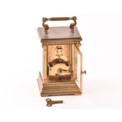 273 - A late 19th/early 20th century ormolu carriage clock, white enamel dial with subsidiary seconds dial... 