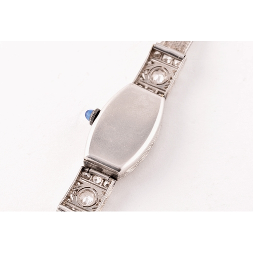 91 - A vintage 9ct white gold and diamond cocktail watch, the silvered numbered dial with tapered blue in... 