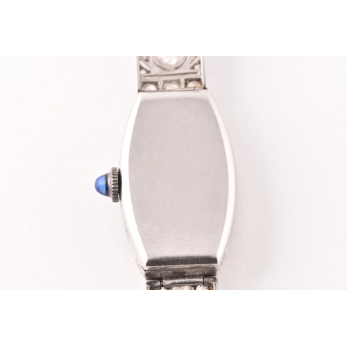 91 - A vintage 9ct white gold and diamond cocktail watch, the silvered numbered dial with tapered blue in... 