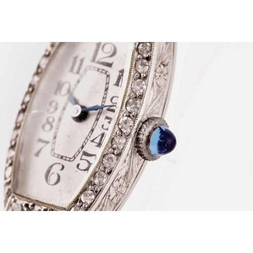 91 - A vintage 9ct white gold and diamond cocktail watch, the silvered numbered dial with tapered blue in... 