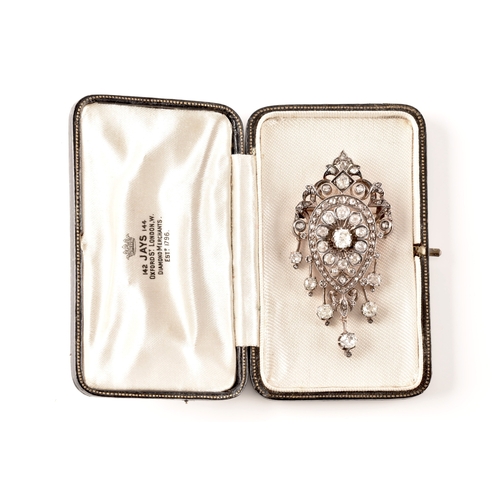 9 - A Victorian diamond brooch/pendant, set to centre with a cushion shape old mine diamond with an appr... 