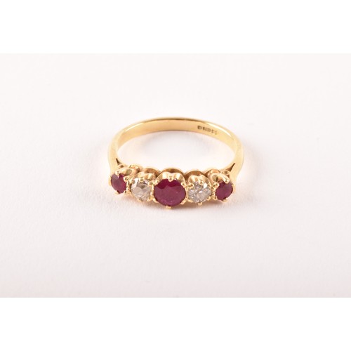 27 - An 18ct yellow gold, diamond, and ruby ring, set with three mixed round-cut rubies, the largest meas... 