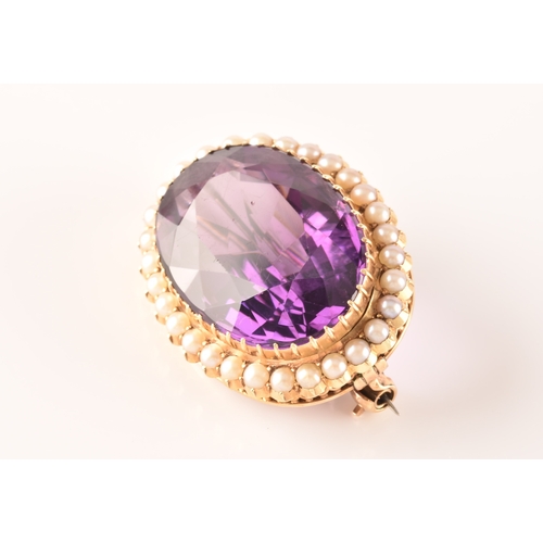 4 - A 10ct yellow gold amethyst and pearl brooch, set to centre with a oval cut amethyst measuring appro... 