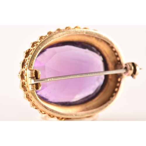 4 - A 10ct yellow gold amethyst and pearl brooch, set to centre with a oval cut amethyst measuring appro... 