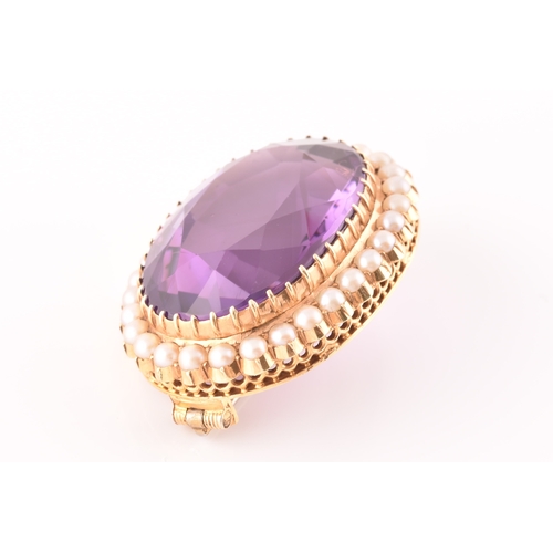 4 - A 10ct yellow gold amethyst and pearl brooch, set to centre with a oval cut amethyst measuring appro... 