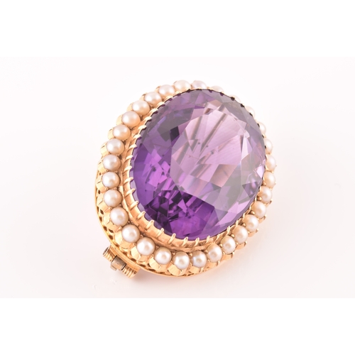 4 - A 10ct yellow gold amethyst and pearl brooch, set to centre with a oval cut amethyst measuring appro... 