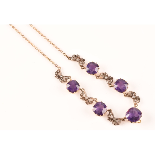 6 - A 15ct yellow gold amethyst and diamond necklace set with five cushion shape amethysts with a combin... 