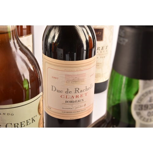 316 - A group of assorted wine and spirits, including a 1997 Duc de Rachelle Claret Bordeaux, a 1981 Chate... 