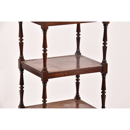 282 - A Victorian mahogany four tier whatnot, with turned columns, single draw to the base and supported o... 