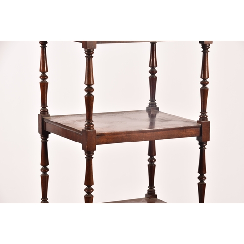 282 - A Victorian mahogany four tier whatnot, with turned columns, single draw to the base and supported o... 