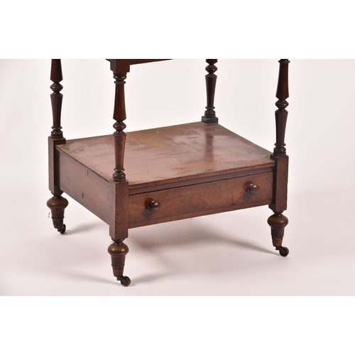 282 - A Victorian mahogany four tier whatnot, with turned columns, single draw to the base and supported o... 