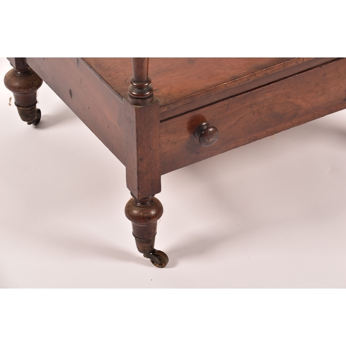 282 - A Victorian mahogany four tier whatnot, with turned columns, single draw to the base and supported o... 