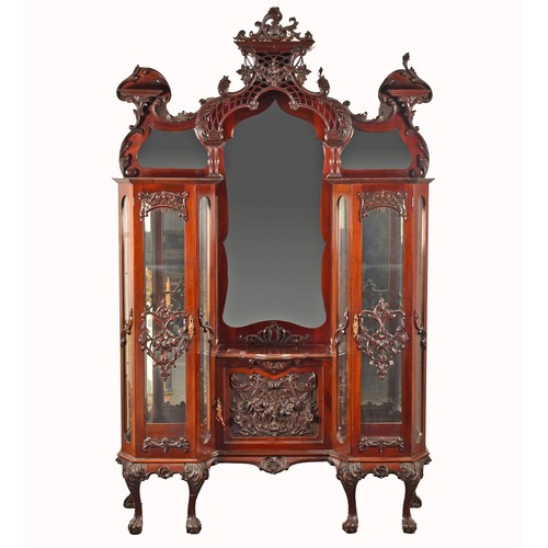 283 - A 19th century carved mahogany display cabinet, the mirrored back with elaborate carved and scrolled... 