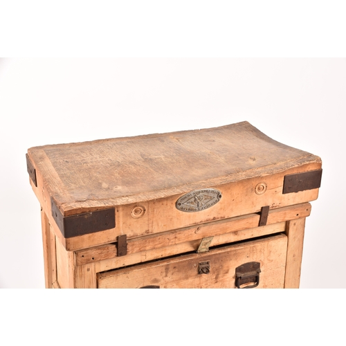 287 - A large Herbert & Sons wooden butchers block on stand, with iron bound corners, supported on a d... 