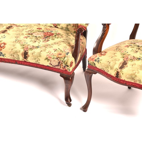 288 - An Edwardian carved mahogany salon suite, comprising a settee, two arm chairs, and four single chair... 