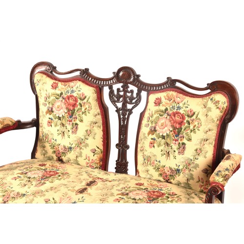 288 - An Edwardian carved mahogany salon suite, comprising a settee, two arm chairs, and four single chair... 