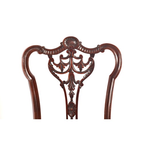 288 - An Edwardian carved mahogany salon suite, comprising a settee, two arm chairs, and four single chair... 