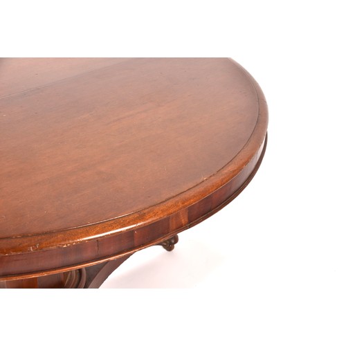 290 - A Regency mahogany circular centre table, the top with moulded rim, supported on a octagonal taperin... 