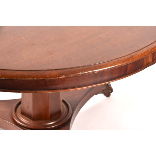 290 - A Regency mahogany circular centre table, the top with moulded rim, supported on a octagonal taperin... 