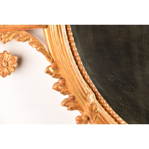 292 - A fine 18th century Adam design gilt gesso oval wall mirror, crested, with an urn and scrolling acan... 