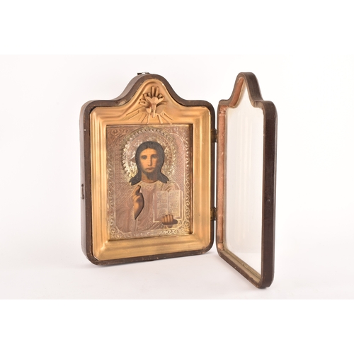 159 - A 19th century Russian cased icon of Christ Pantocrator, with a gilt metal riza and engraved oklad, ... 