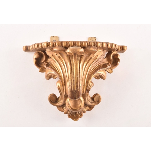 253 - A group of eight carved gilt sconces, largest measuring 22.5 cm height x 20 cm width, six sconces me... 