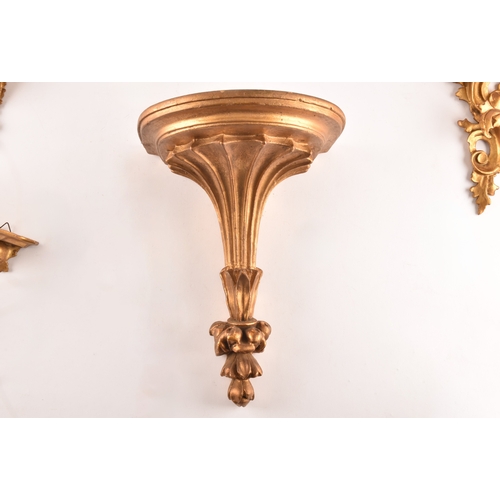 253 - A group of eight carved gilt sconces, largest measuring 22.5 cm height x 20 cm width, six sconces me... 