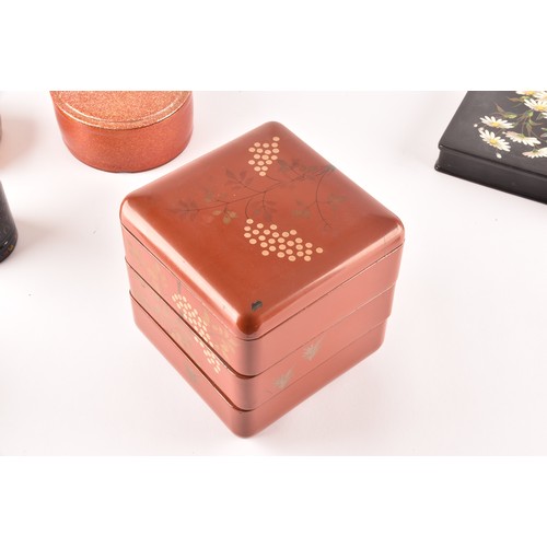 255 - A group of lacquer boxes, including a Japanese red lacquer box and cover, a Victorian box painted wi... 