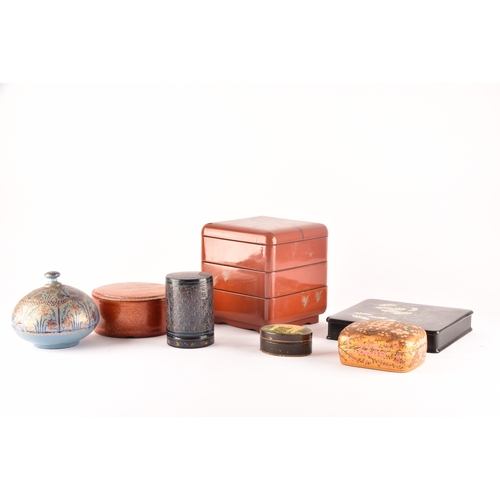 255 - A group of lacquer boxes, including a Japanese red lacquer box and cover, a Victorian box painted wi... 