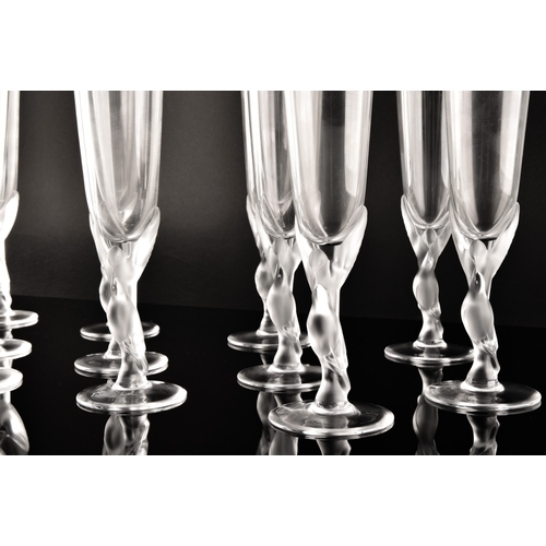 226 - A set of twelve Igor Carl Fabergé crystal champagne flutes, the frosted stems modelled as two kissin... 