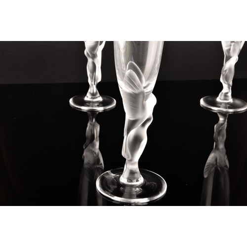 226 - A set of twelve Igor Carl Fabergé crystal champagne flutes, the frosted stems modelled as two kissin... 