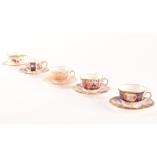 227 - A collection of Royal Worcester twelve miniature cups and saucers of varying designs, two unmarked m... 