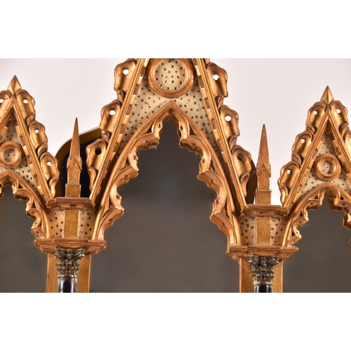 295 - A architectural gilt and painted five panel wall mirror, each panel with gothic carved surround, col... 