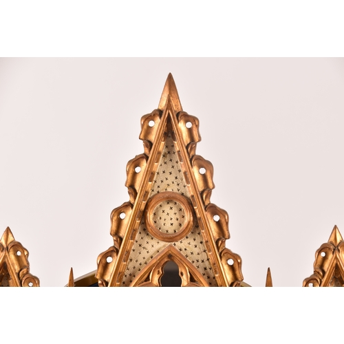 295 - A architectural gilt and painted five panel wall mirror, each panel with gothic carved surround, col... 